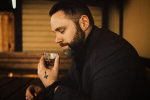 Man smelling whisky glass