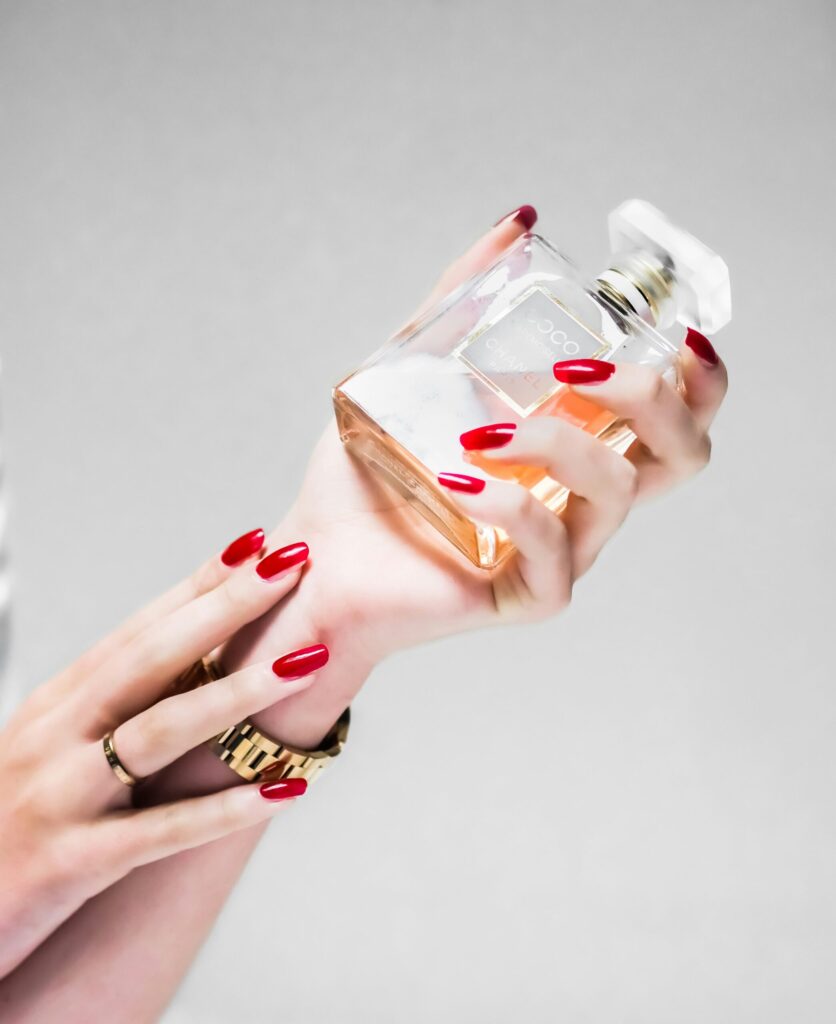 Woman holding perfume bottle