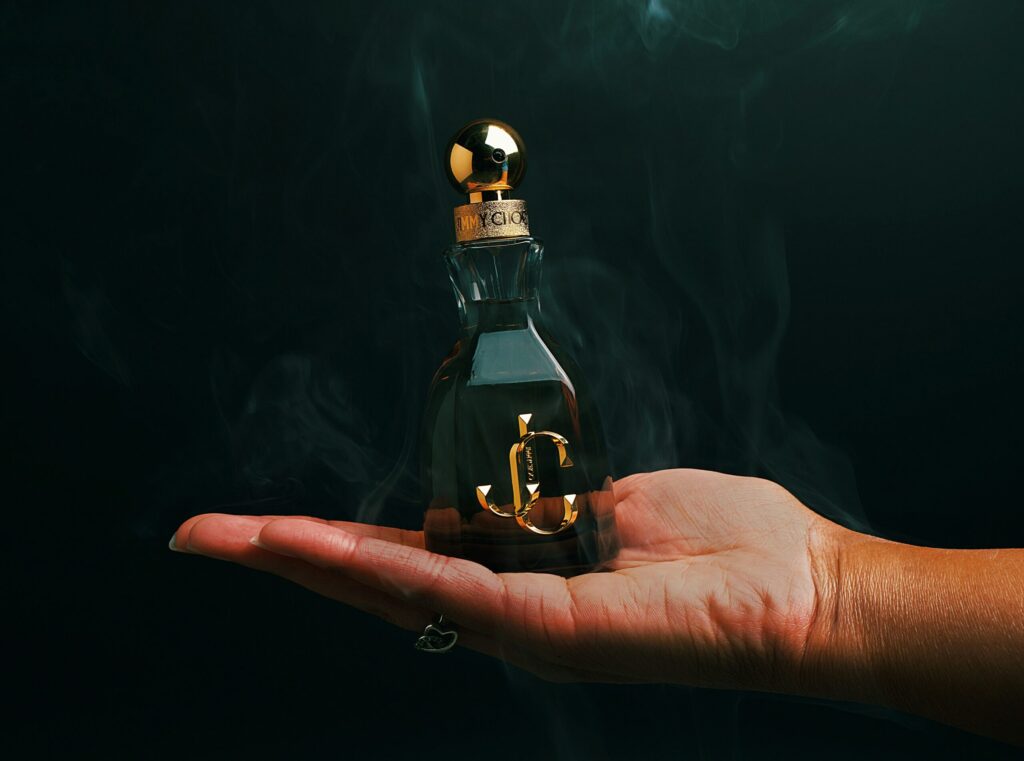 Perfume bottle in lady's hand